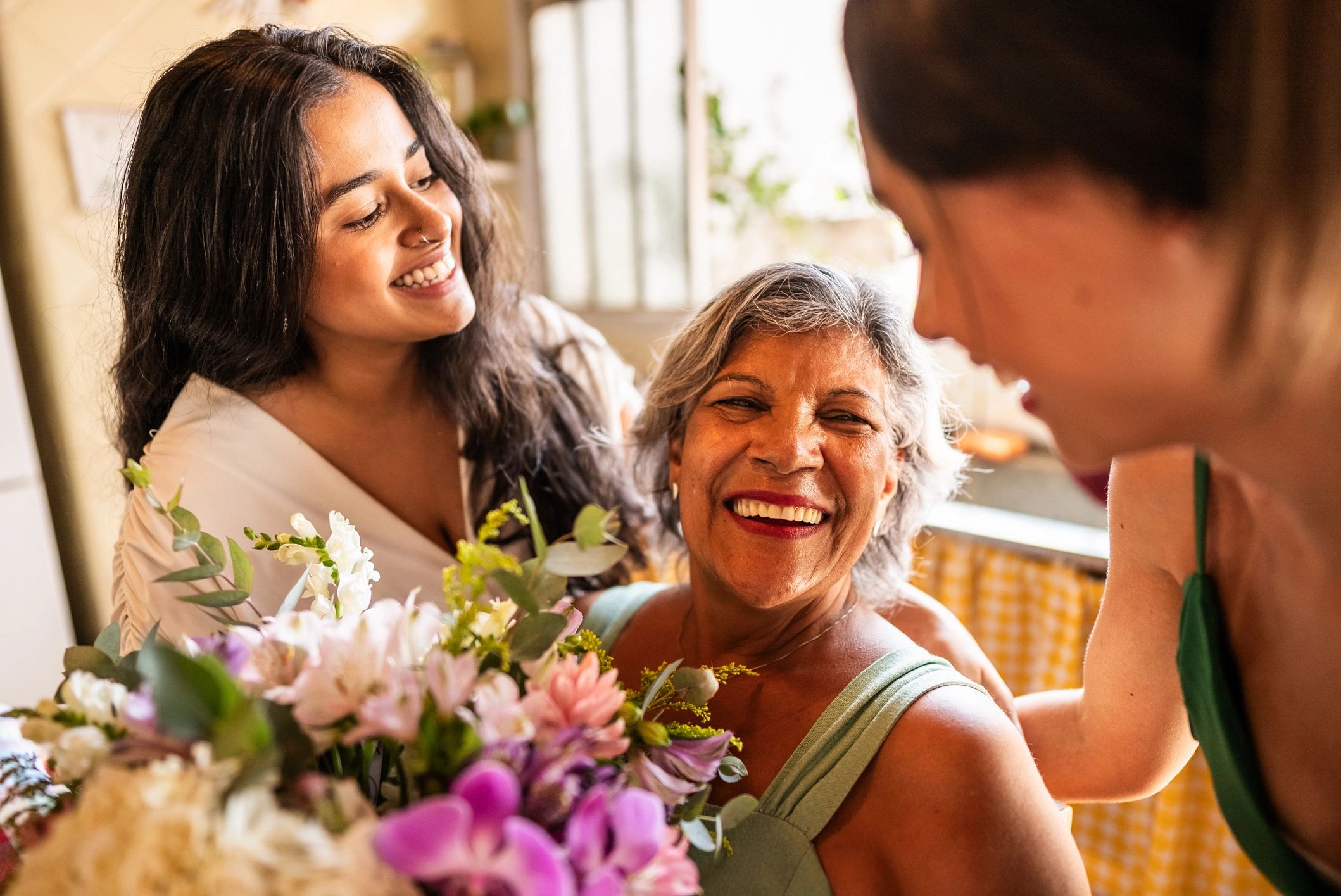 Family members sharing flowers at home